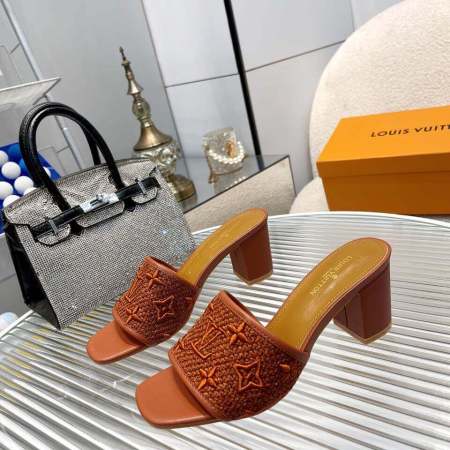 a pair of Louis Vuitton LV Mare Mule In Brown on a glass table