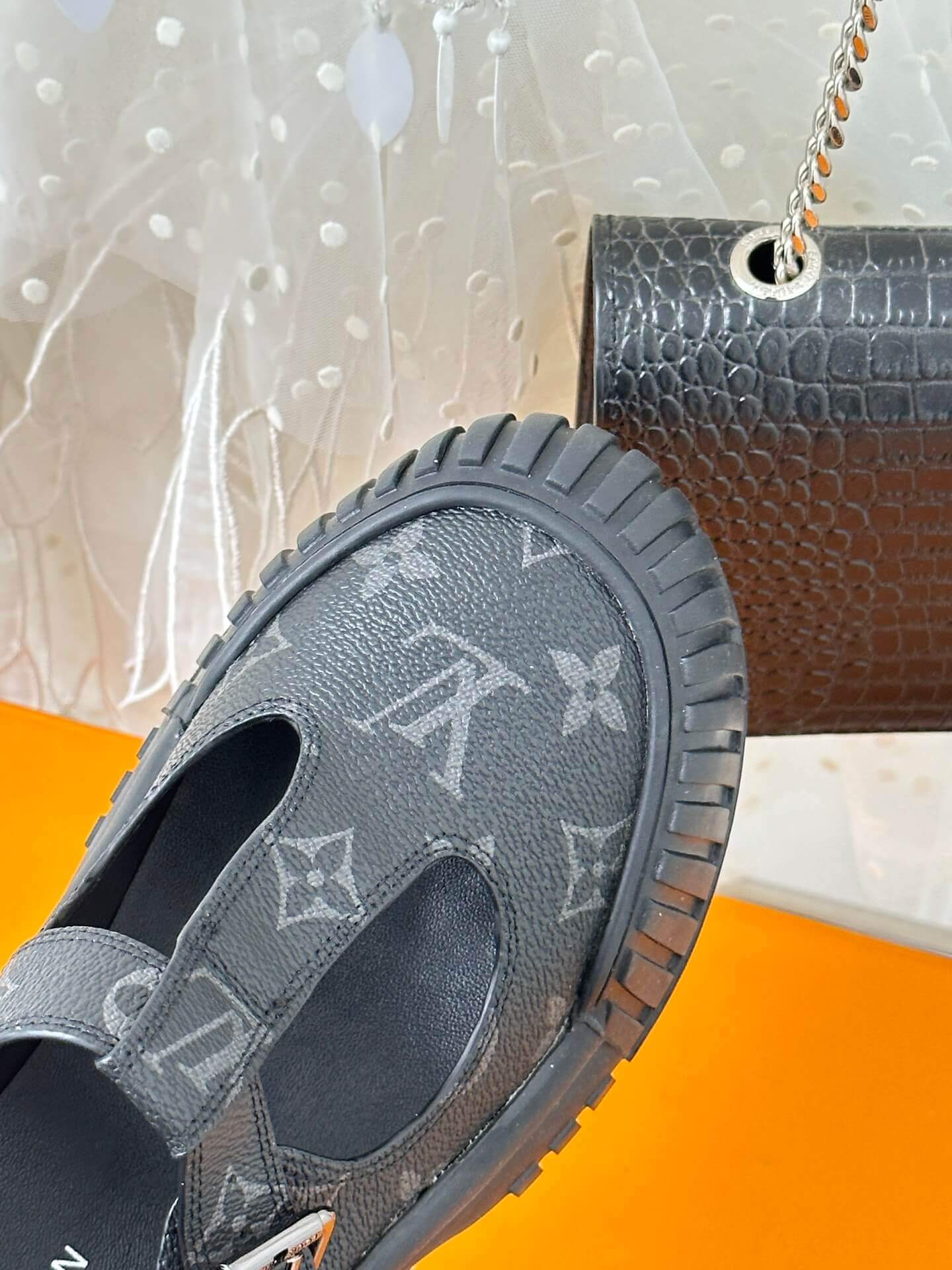 a pair of Louis Vuitton LV Ruby Flat Mary Jane in black Monogram canvas.
