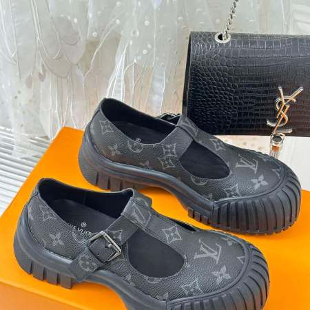 a pair of Louis Vuitton LV Ruby Flat Mary Jane in black Monogram canvas.