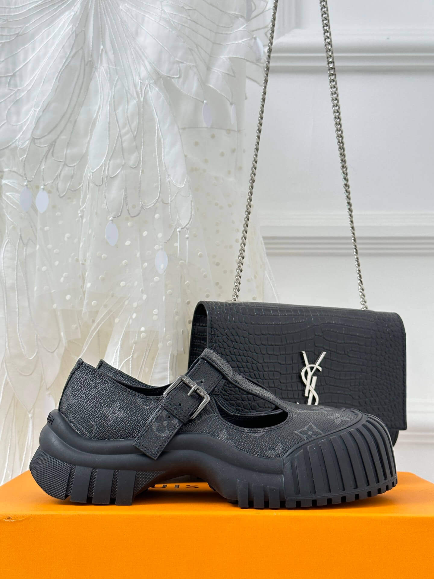 a pair of Louis Vuitton LV Ruby Flat Mary Jane in black Monogram canvas.