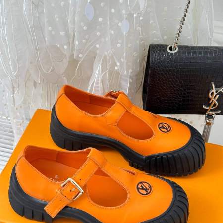 a pair of Louis Vuitton LV Ruby Flat Mary Jane in orange and black