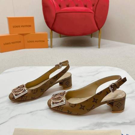 a pair of Louis Vuitton Madeleine Slingback Pump in Monogram canvas on a marble surface