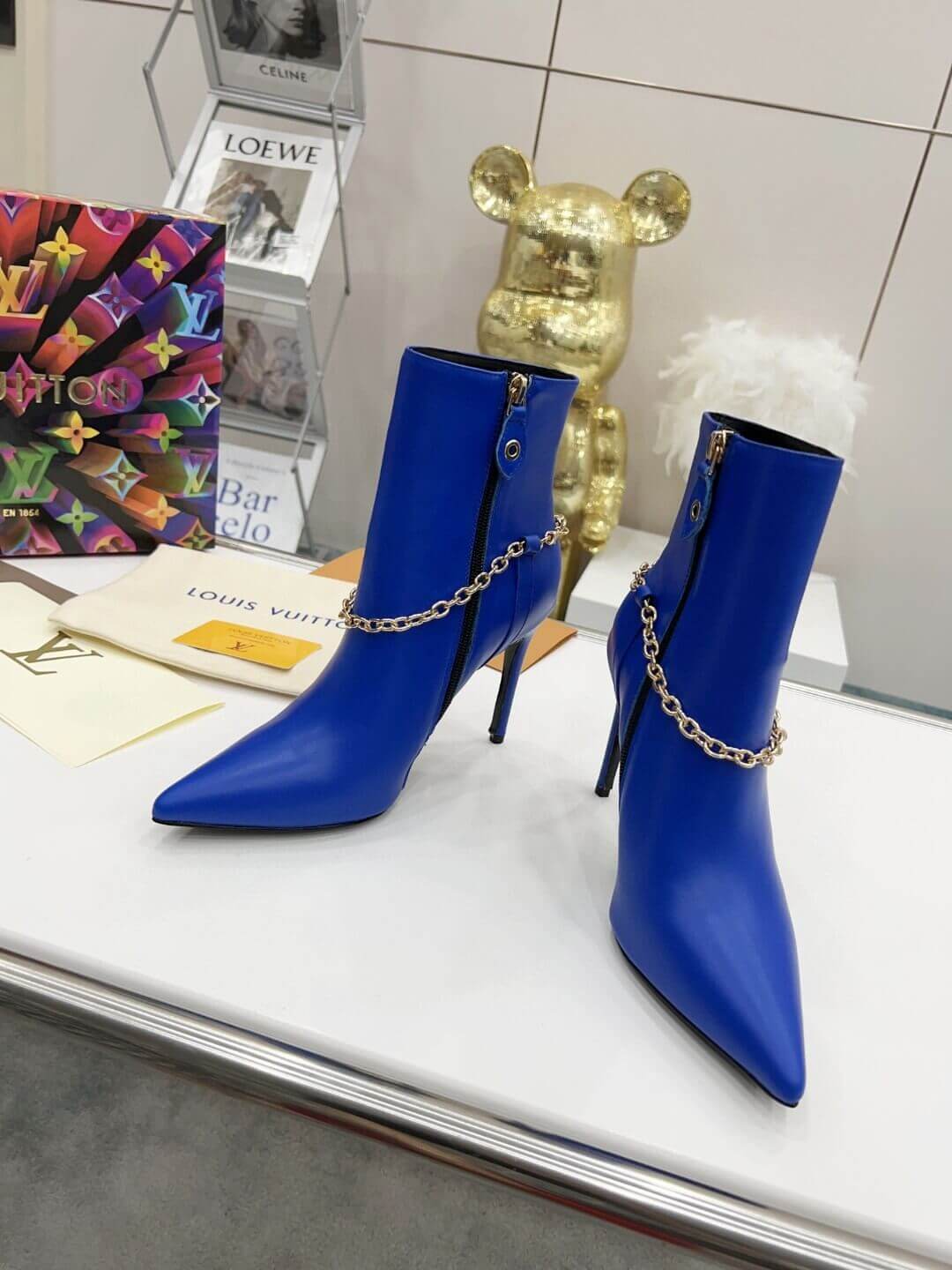 a pair of Louis Vuitton Mansion Chain Ankle Boots In Blue