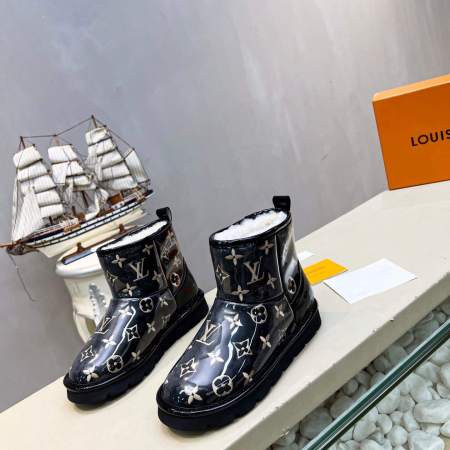 a pair of Louis Vuitton Polar Monogram Shearling Boots Black Patent leather on a shelf