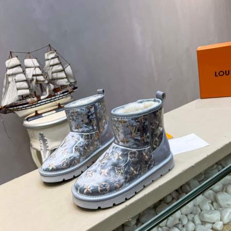 a pair of Louis Vuitton Polar Monogram Shearling Boots In Silver on a shelf