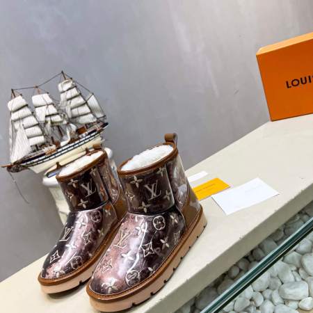 Louis Vuitton Polar Monogram Shearling Boots in Brown on a shelf with a model ship