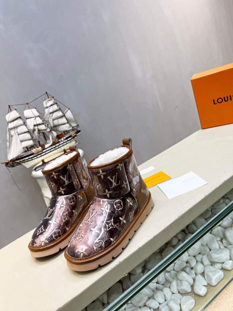 Louis Vuitton Polar Monogram Shearling Boots in Brown on a shelf with a model ship