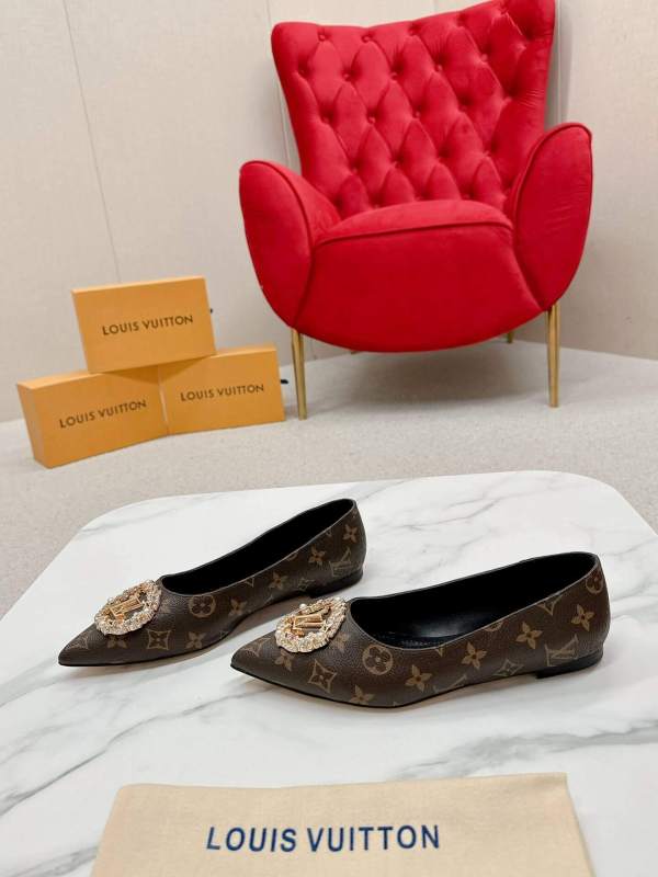 a pair of Louis Vuitton Revival Mule in Monogram Canvas – Crystal‑Embellished Flat Shoe on a box