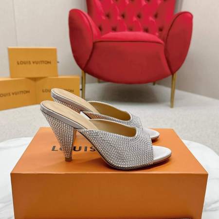 a pair of Louis Vuitton Super Mule – Silver Crystal Elegance on a box