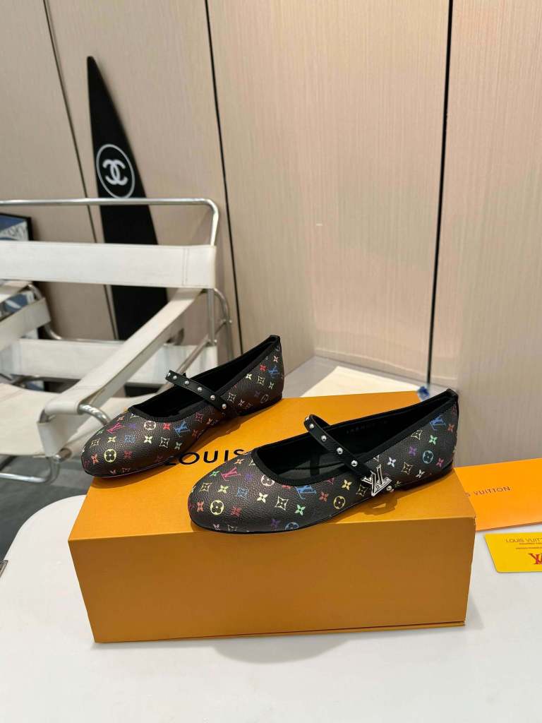 a pair of Louis Vuitton x Murakami Romy Flat Ballerina on a box
