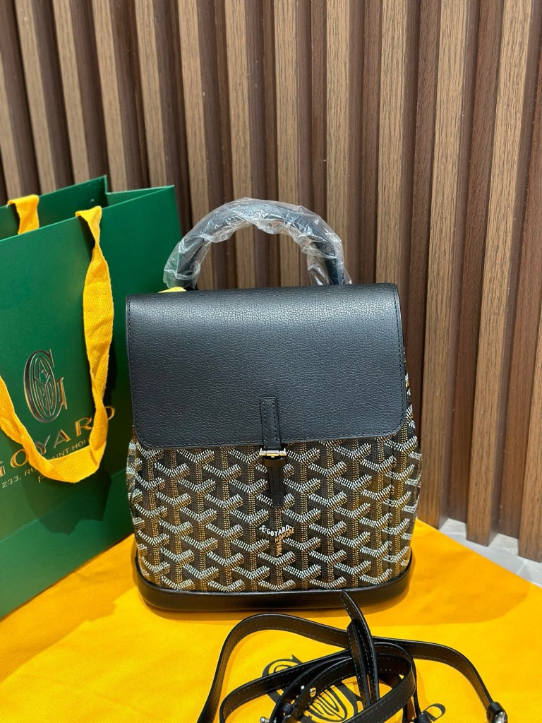 Goyard Black Goyardine Canvas Alpin Mini Backpack, made in France, 23 × 9.5 × 19 cm, with black leather trim and versatile straps.
