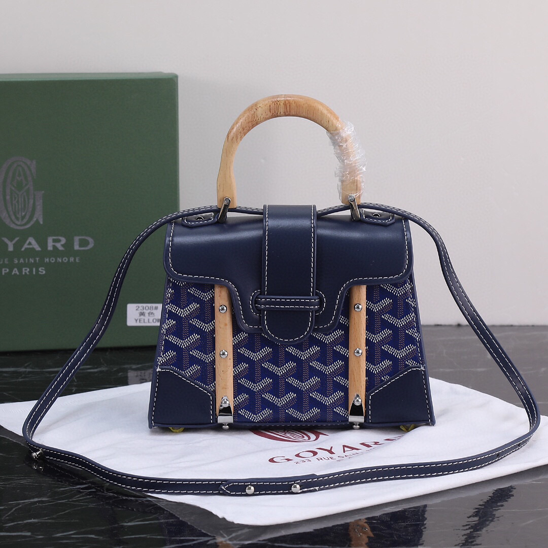 Goyard Blue Goyardine Coated Canvas and Leather Saigon MM Top Handle Bag with wooden handle and navy Goyardine canvas.
