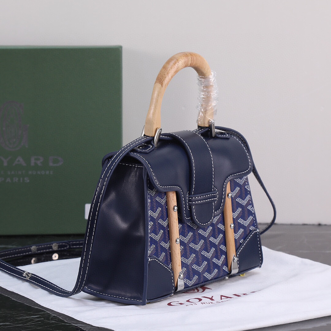 Goyard Blue Goyardine Coated Canvas and Leather Saigon MM Top Handle Bag with wooden handle and navy Goyardine canvas.