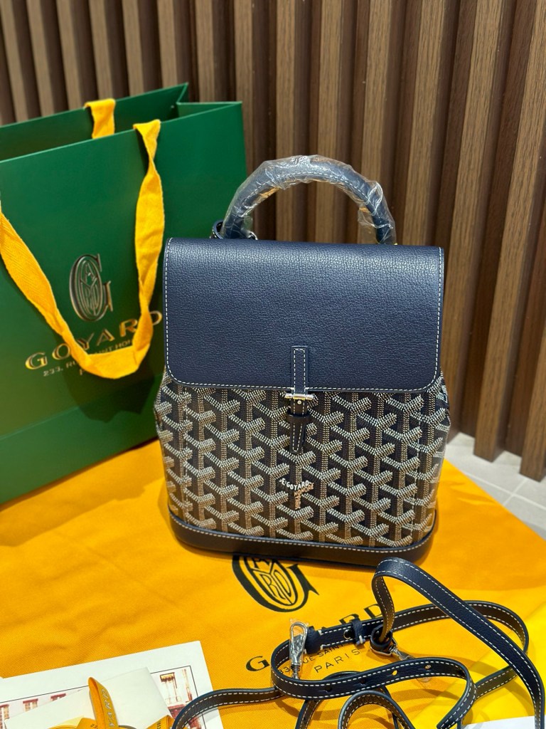 Goyard Navy Goyardine Canvas Alpin Mini Backpack, made in France, 23 × 9.5 × 19 cm, navy leather trim with adjustable straps.
