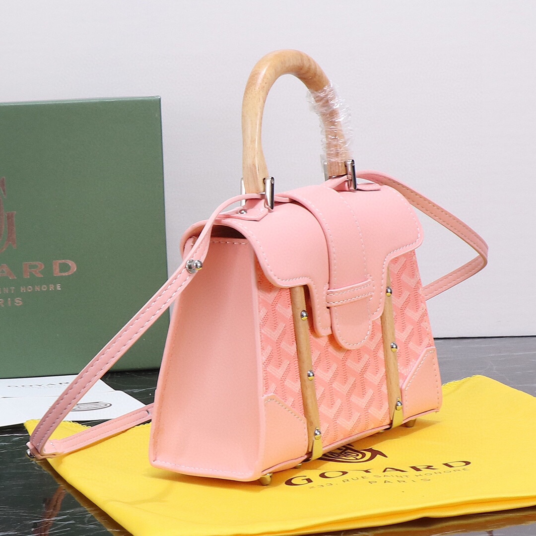 Goyard Pink Goyardine Coated Canvas and Leather Saigon MM Top Handle Bag with wooden handle and blush leather trim.