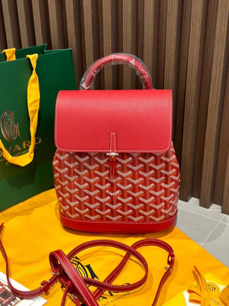 Goyard Red Goyardine Canvas Alpin Mini Backpack, made in France, 23 × 9.5 × 19 cm, vibrant red with leather trim and versatile straps.