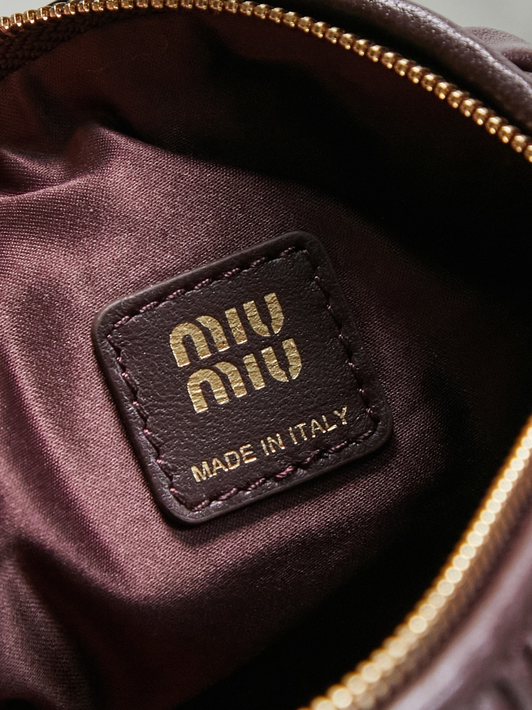 Miu Miu burgundy matelassé leather mini shoulder bag with gold logo