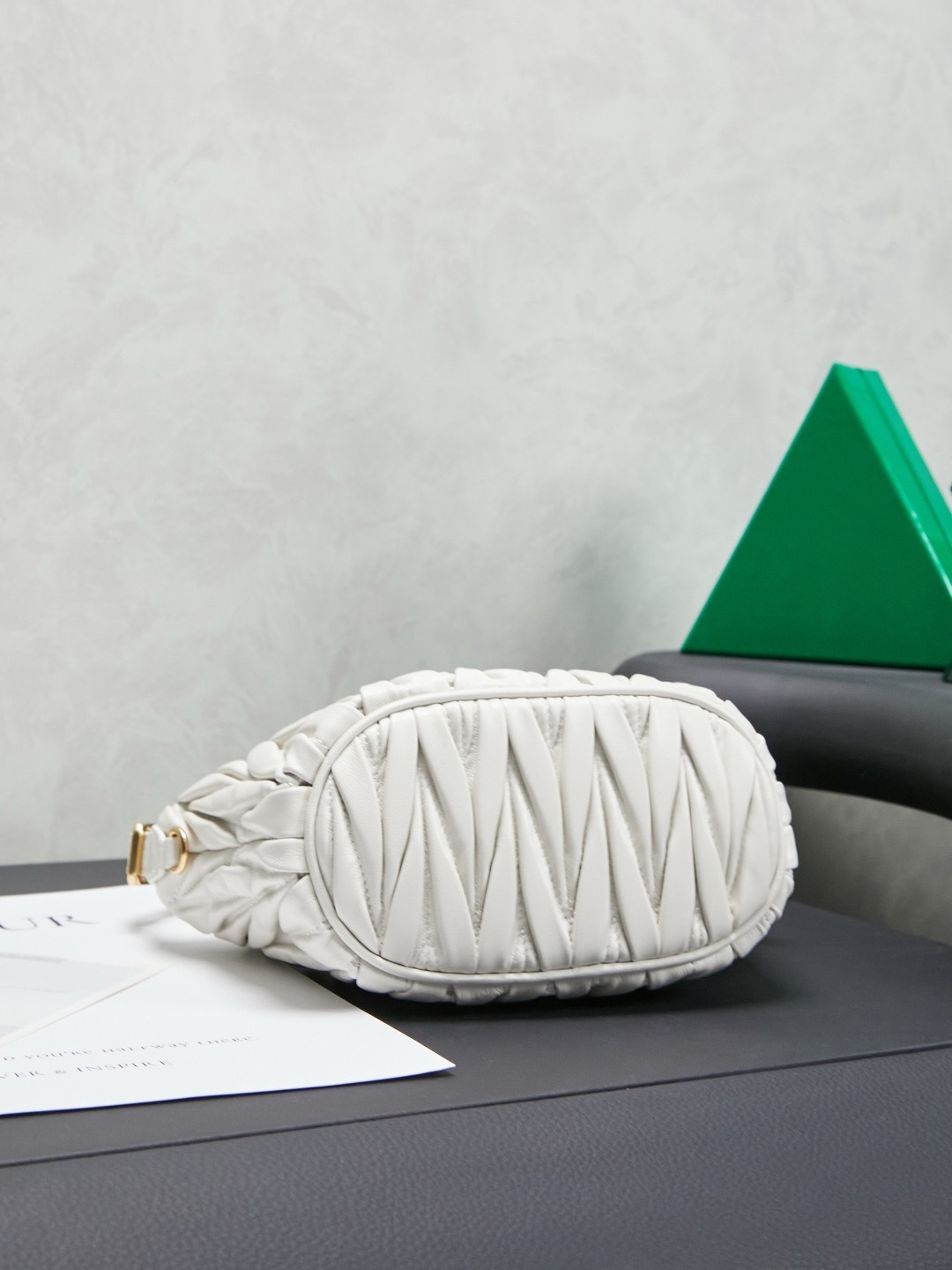 Miu Miu White Matelassé Leather Mini Shoulder Bag with gold-tone hardware and adjustable strap.