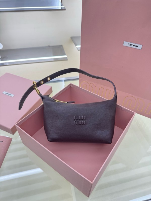 Miu Miu dark brown leather paddle shoulder bag front view in pink box