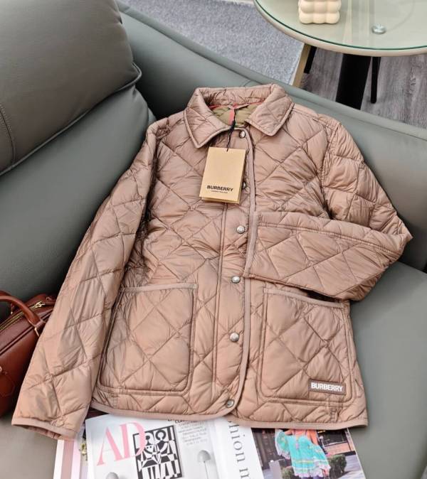 Burberry Quilted Long Jacket with a Hood in a light brown/tan color.