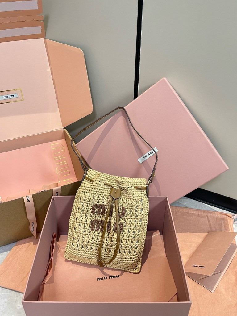 Miu Miu Natural Raffia-Effect Woven Mini Bag with brown embroidered logo, leather strap, and drawstring closure, size 20 x 23 cm.