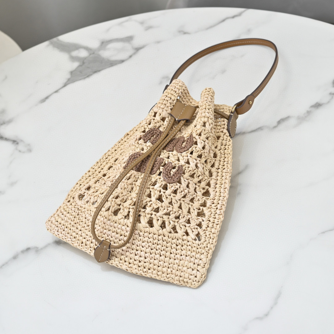 Miu Miu Natural Raffia-Effect Woven Mini Bag with brown logo, leather strap, and drawstring closure, size 20 x 23 cm.