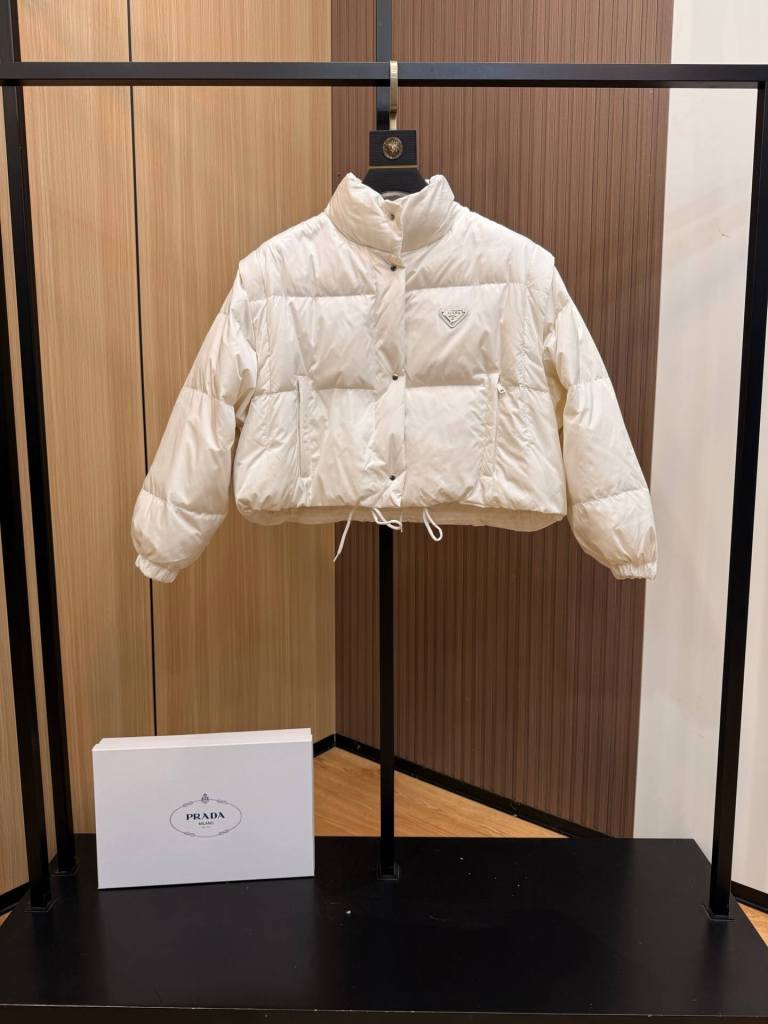 Prada Re-Nylon Cropped Down Jacket in a light, off-white,