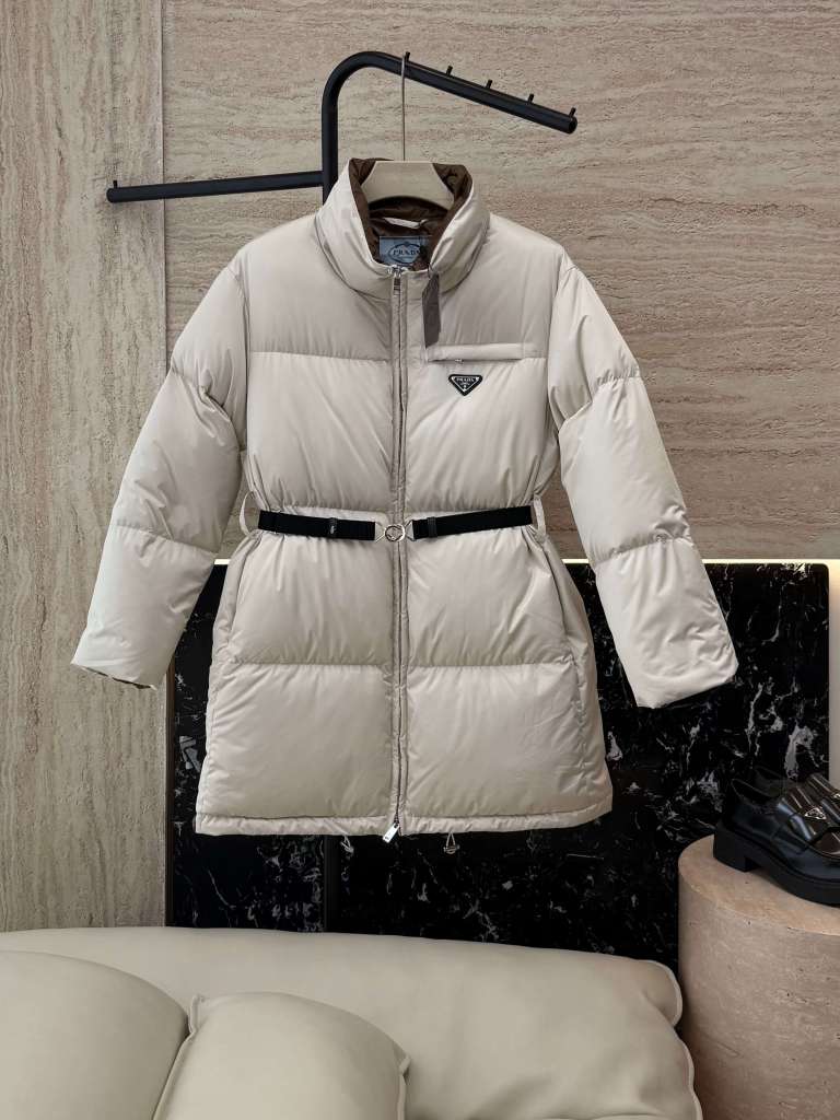 Prada Mid-Length Women's Down Jacket with a Belt in a light beige color.