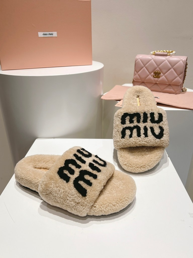 Miu Miu Beige and Black Logo Shearling Slides