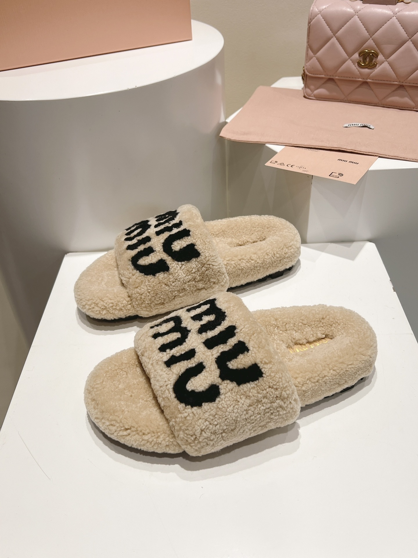 Miu Miu Beige and Black Logo Shearling Slides - Image 6