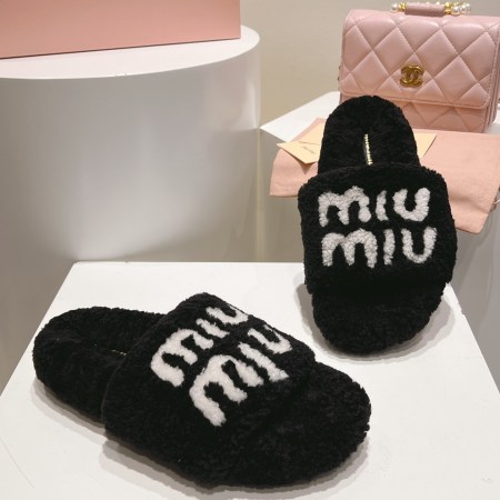 Miu Miu Black and White Logo Shearling Slides
