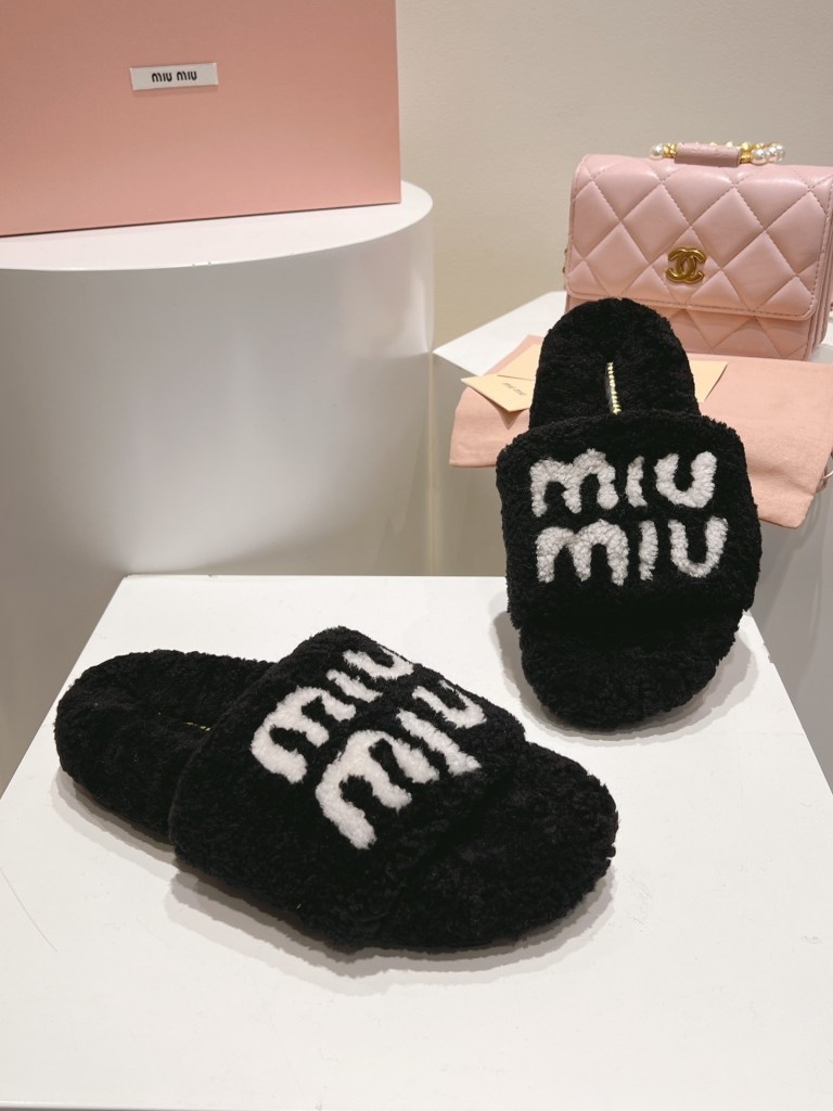 Miu Miu Black and White Logo Shearling Slides