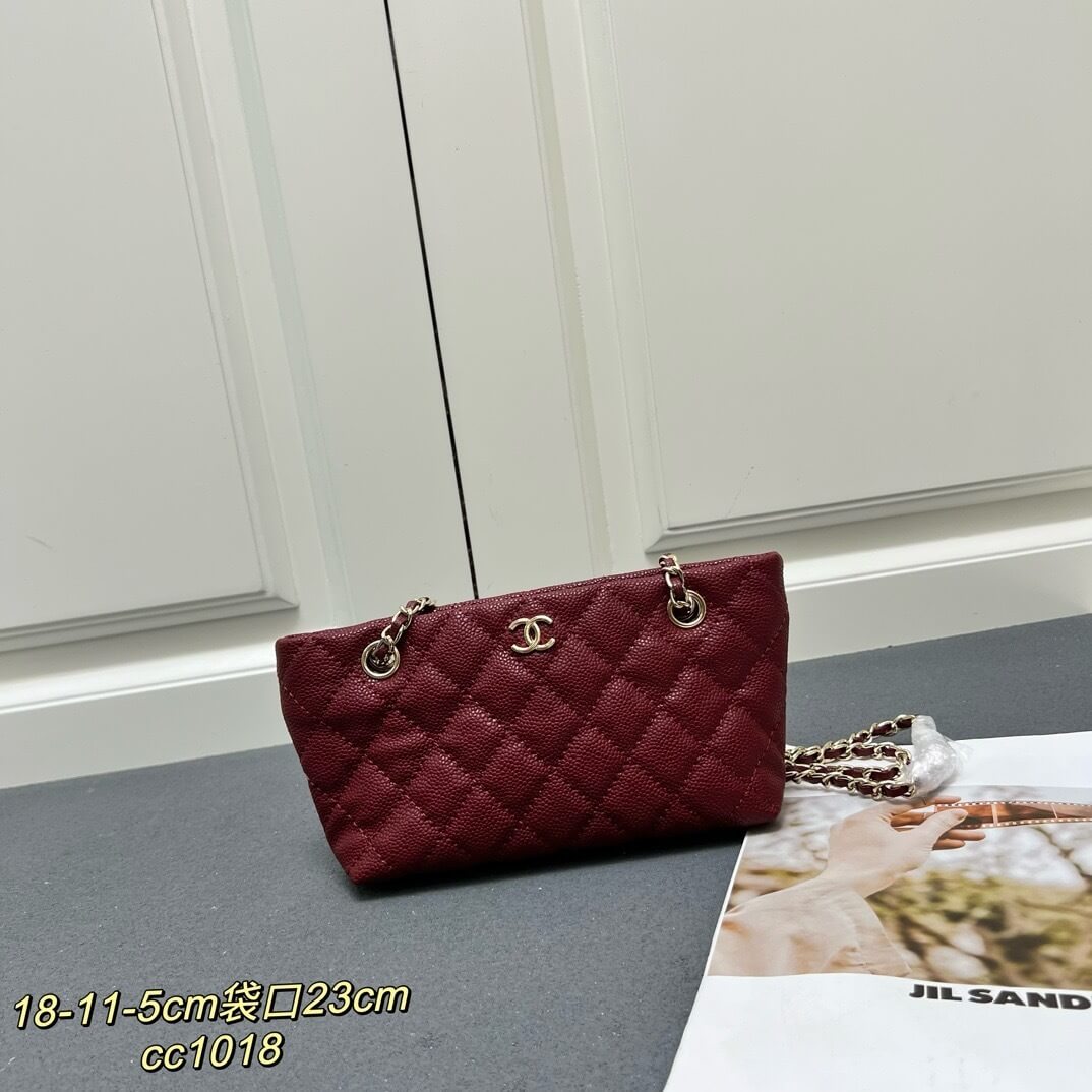 Chanel Burgundy Caviar Quilted Mini Shopping Tote Bag with Gold-Tone Hardware.