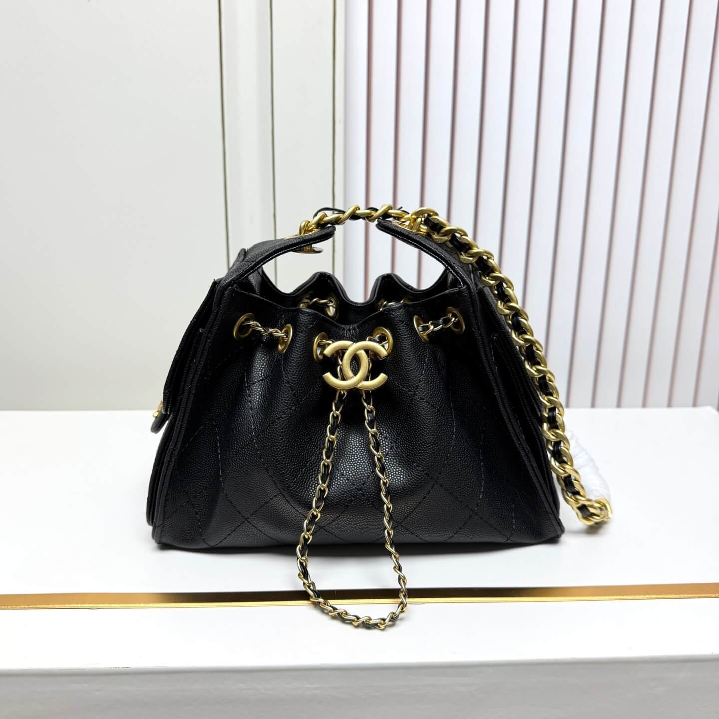Chanel Quilted Caviar Leather Drawstring Bucket Bag in Black
