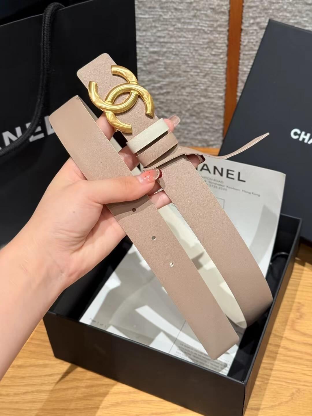 Chanel Beige Calfskin Leather Belt with Gold-Tone CC Buckle and White Contrast Keeper.