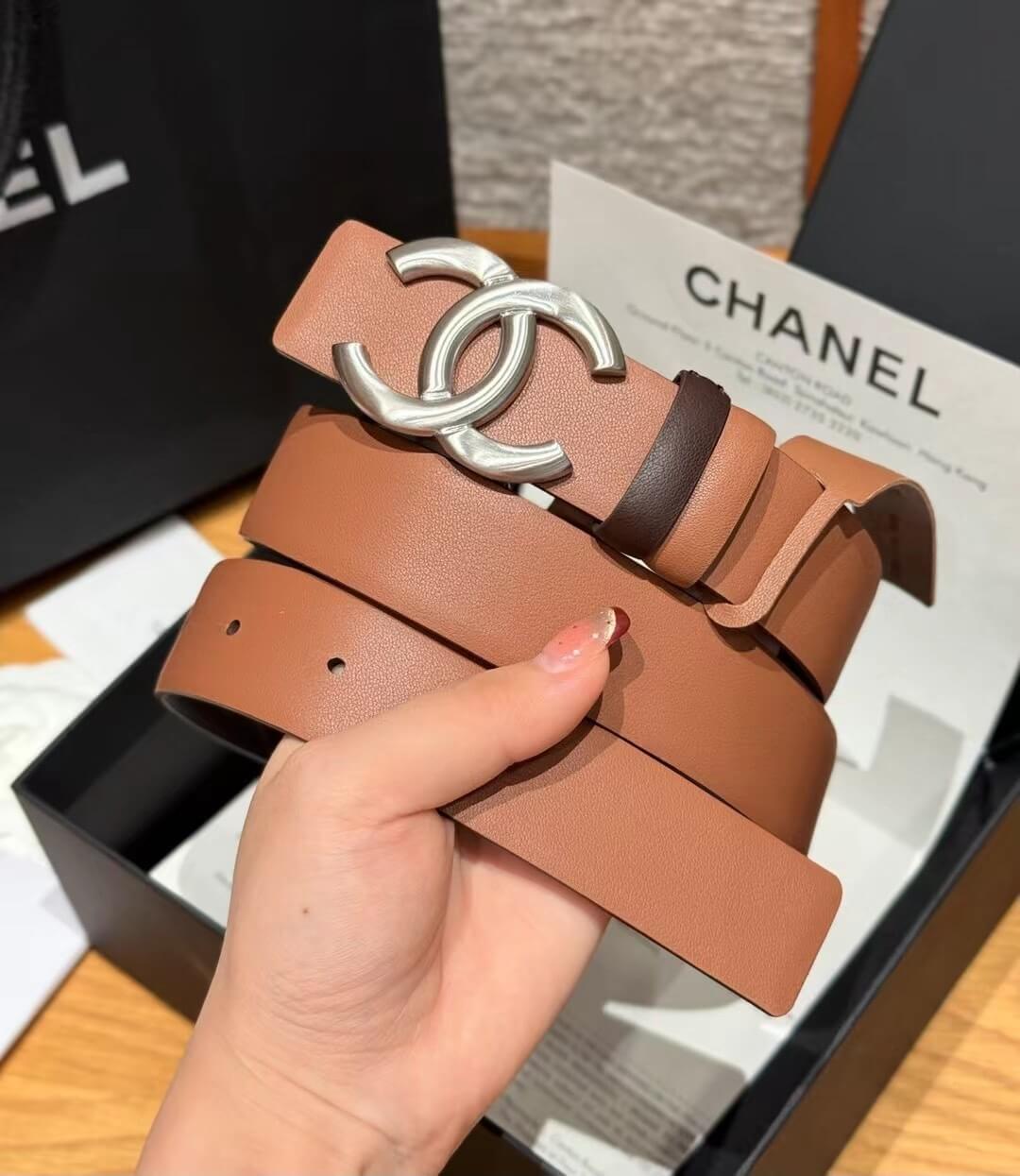 Chanel Tan Calfskin Leather Belt with Silver-Tone CC Buckle and Contrast Keeper.