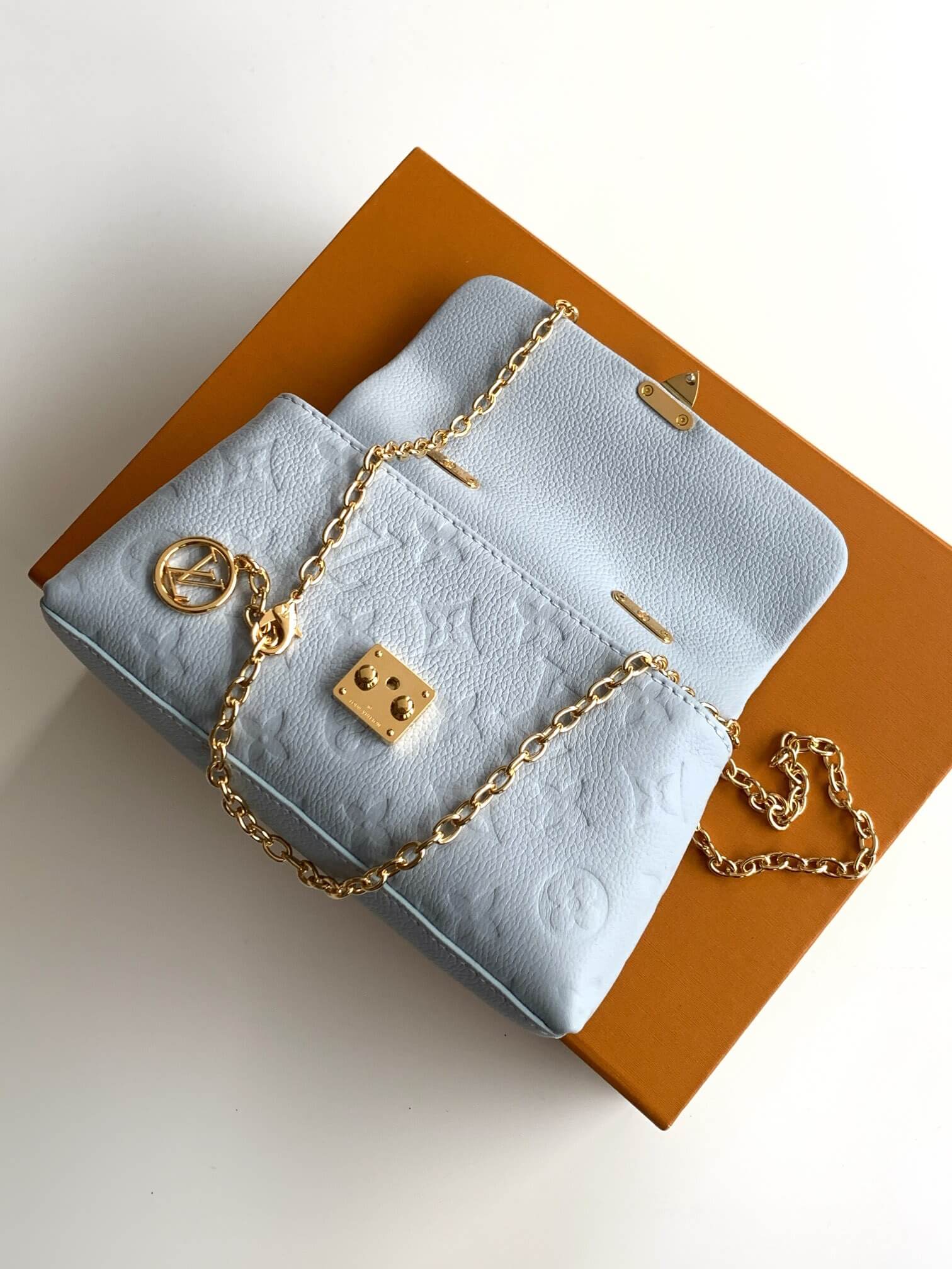 Louis Vuitton Monogram Empreinte Leather Micro Metis Light Blue Crossbody Bag with Gold Hardware and Luxury Trunk Display - Image 7