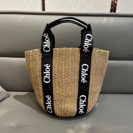 Chloé Woody Medium Basket Bag in Black Woven Straw with Logo Webbing Straps.