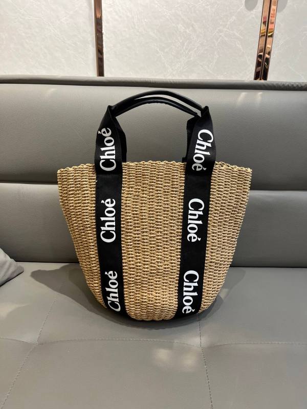 Chloé Woody Medium Basket Bag in Black Woven Straw with Logo Webbing Straps.