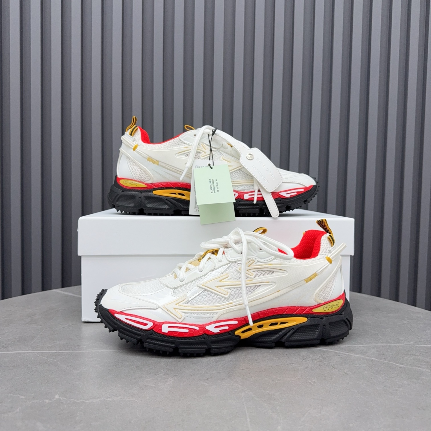 Off-White Be Right Back runner sneakers in a white, red, and yellow Colorway