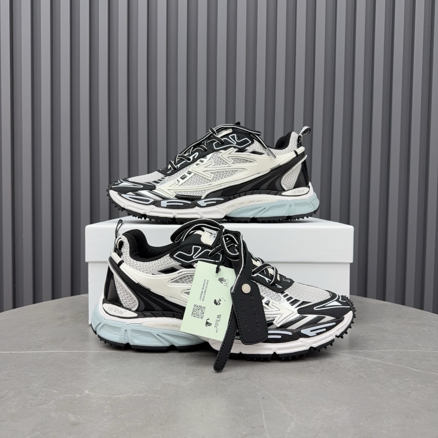 Off-White Be Right Back sneakers in a light grey and black colorway.