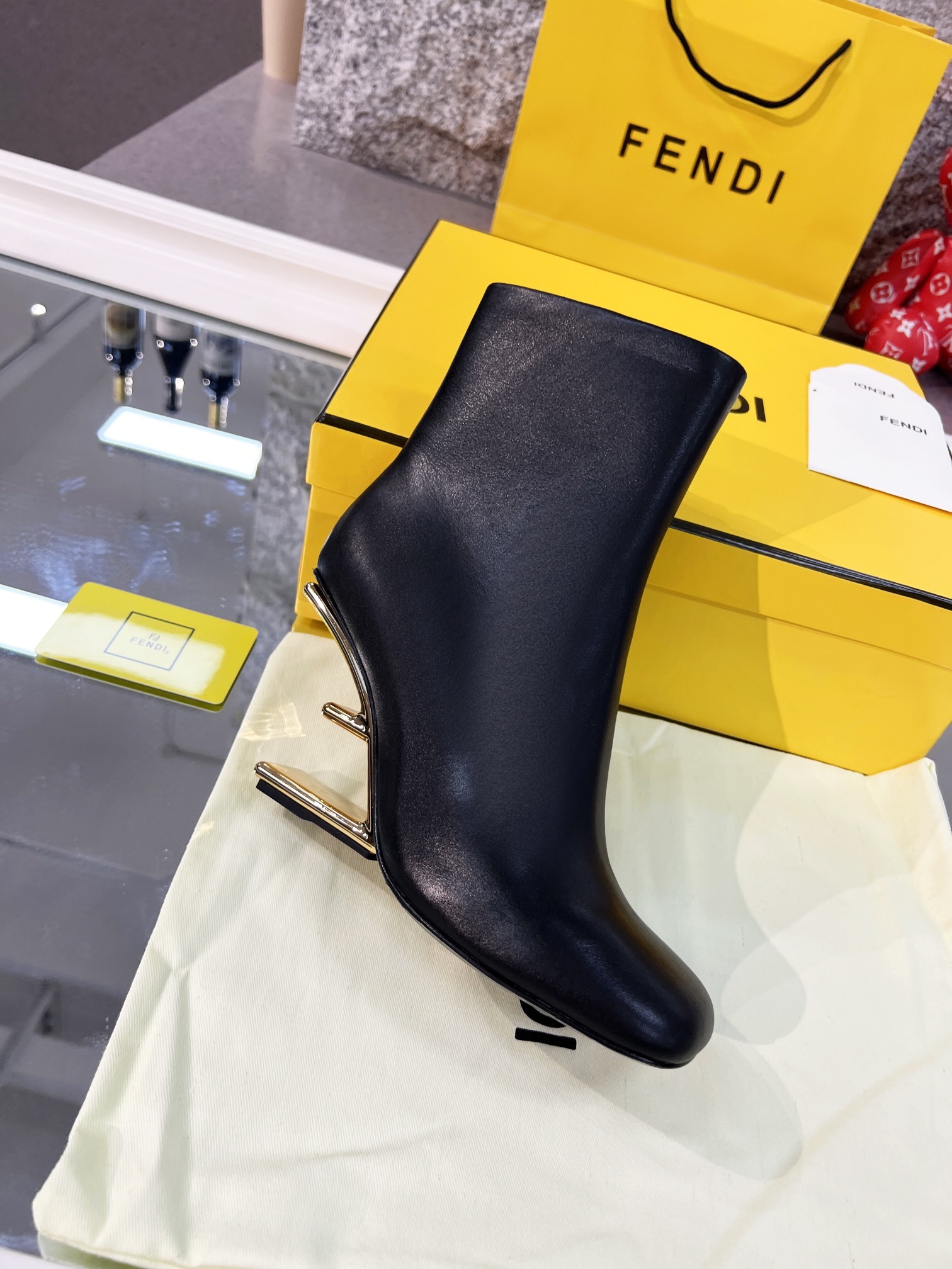 Fendi Black Leather Ankle Boots with Gold-Tone Logo Heel - Image 5