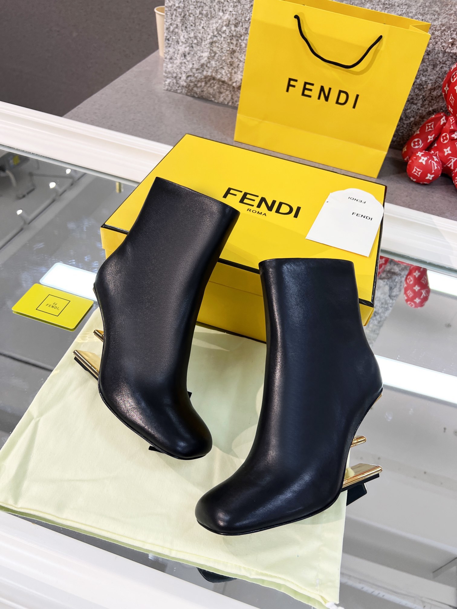 Fendi Black Leather Ankle Boots with Gold-Tone Logo Heel - Image 3