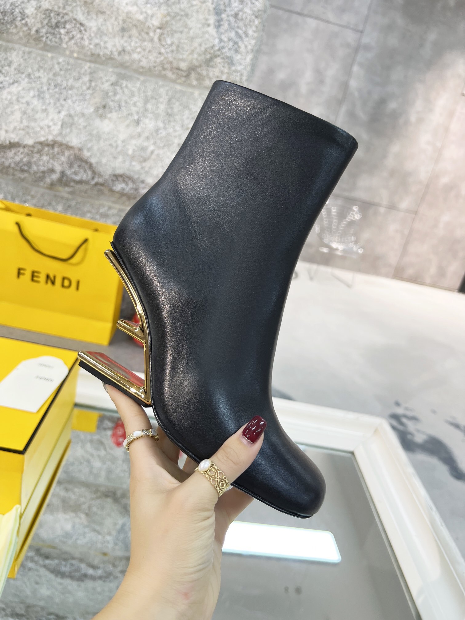 Fendi Black Leather Ankle Boots with Gold-Tone Logo Heel - Image 2