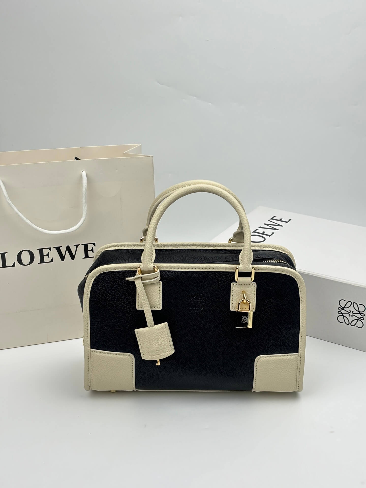Loewe Amazona 28 Black and Cream Grained Calfskin Leather Top Handle Bag.