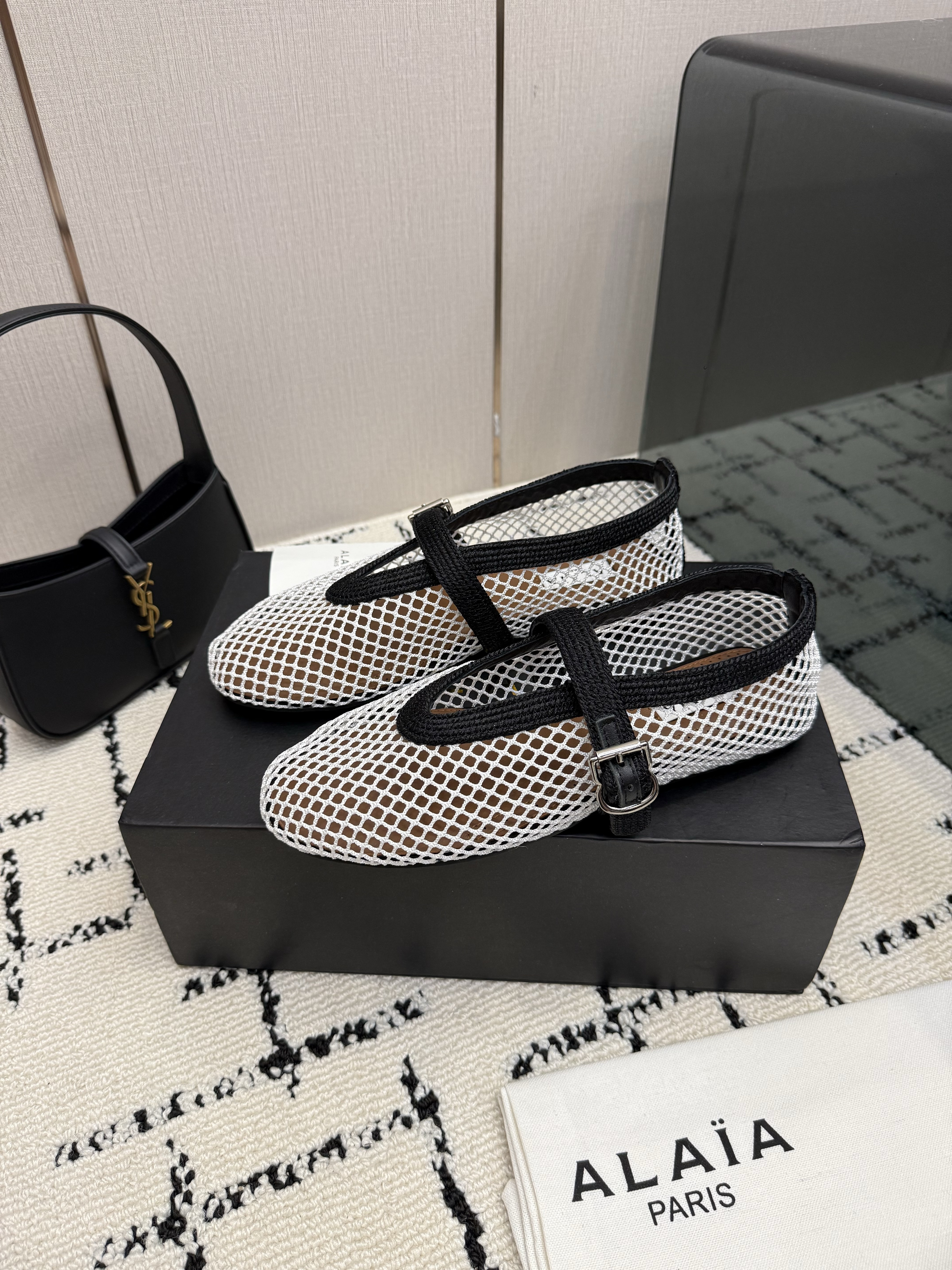 Alaïa White and Black Fishnet Buckled Ballet Flats