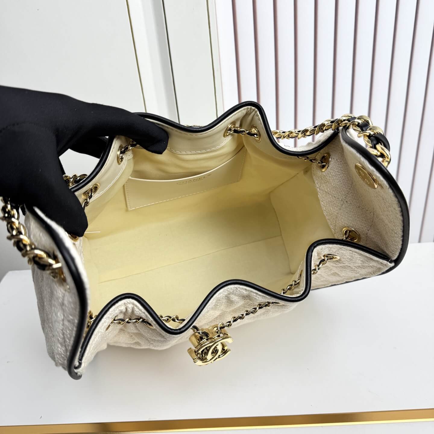 Chanel Quilted Canvas Hobo Bag with Black Trim and Gold-Tone Chain Hardware. - Image 2