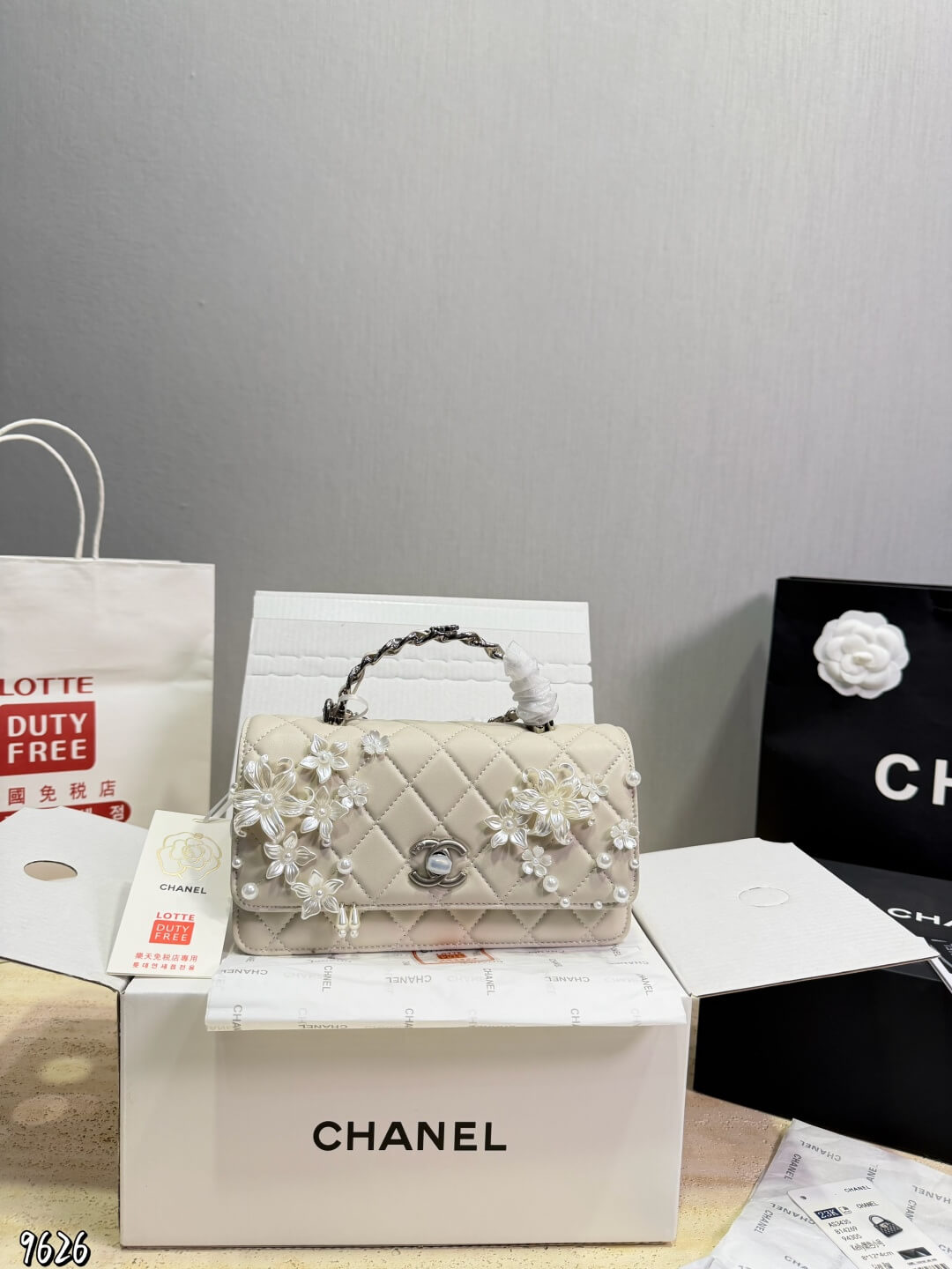 Chanel Quilted Lambskin Floral Camellia Pearl Embellished Mini Flap Bag Top Handle.
