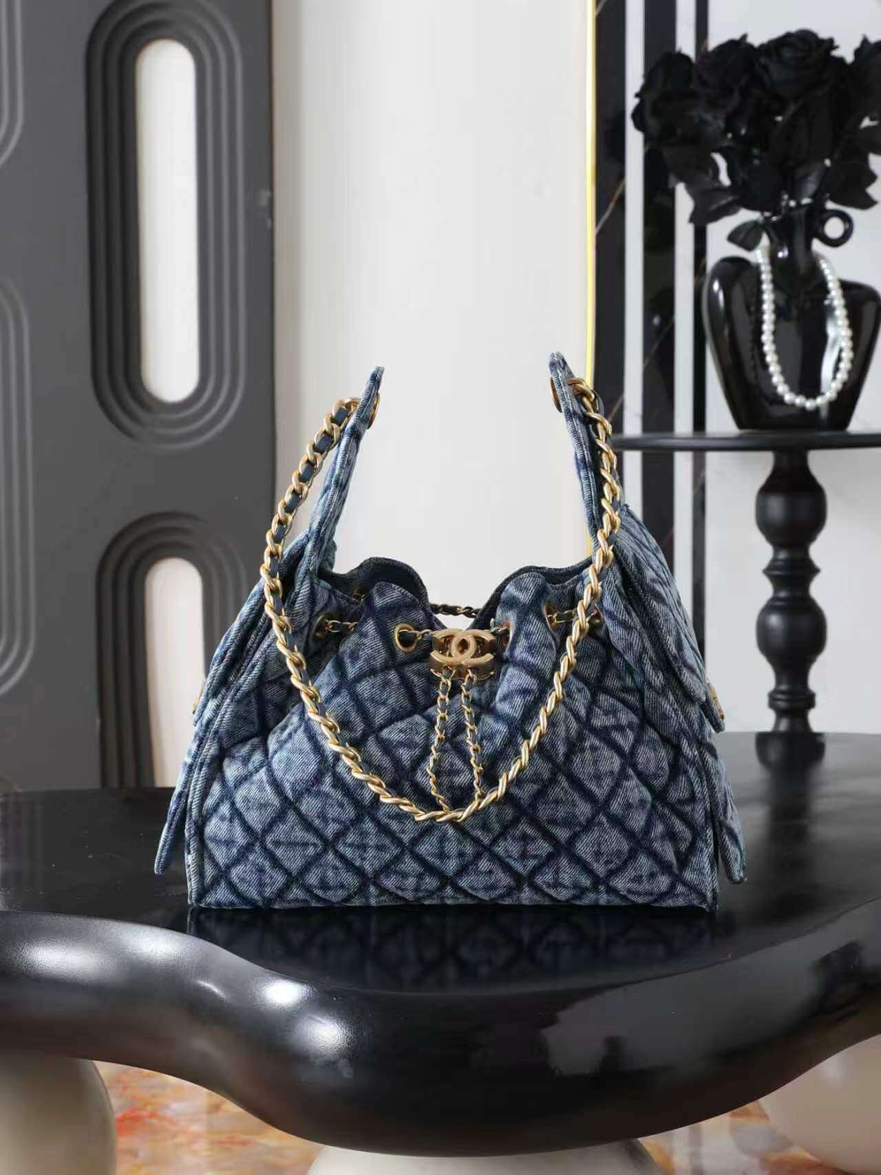 Chanel 22 Small Quilted Washed Denim Drawstring Tote Bag Blue.